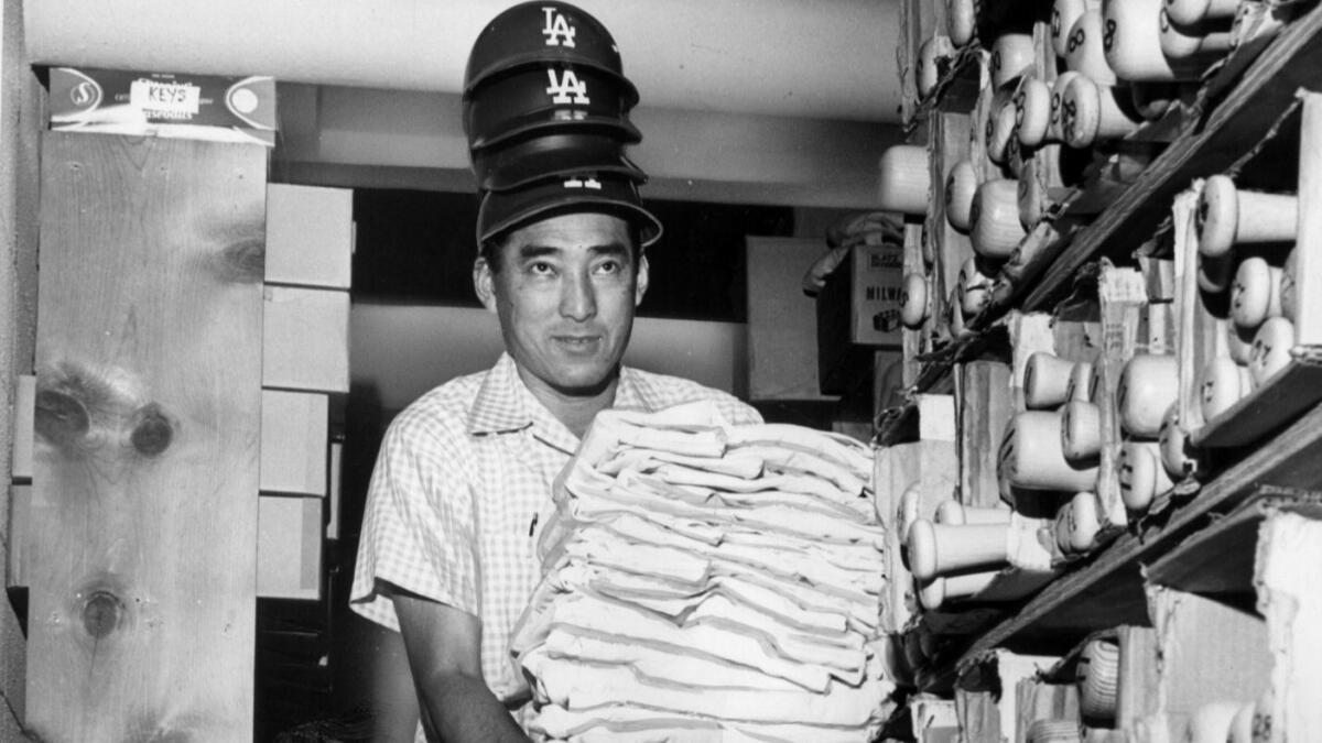 Dodgers equipment manager, Nobe Kawano, is shown with just a portion of the gear that the club will use in a single season.