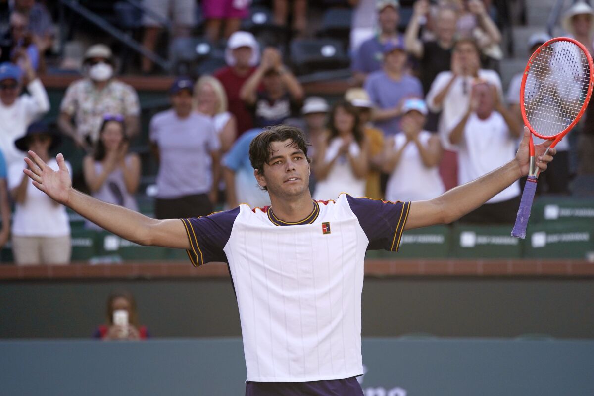 Taylor Fritz soaks in the applause after beating Alexander Zverev in three sets in the BNP Paribas Open quarterfinals.
