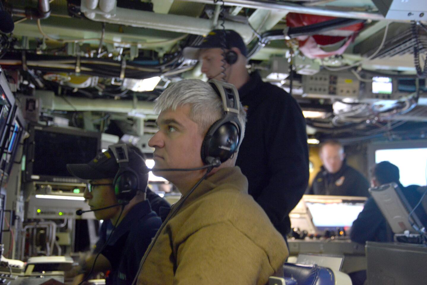 Crew members maneuver the Mississippi as they prepare to submerge off Hawaii. The Virginia-class fast-attack submarine will be deployed to the Western Pacific next year.