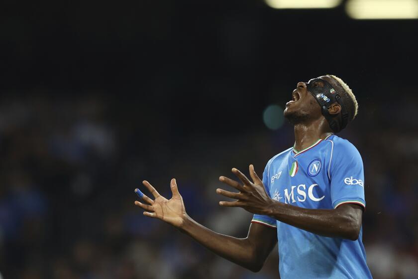 Napoli's Victor Osimhen reacts during the Serie A soccer match between Napoli and Udinese at the Diego Armando Maradona stadium in Naples, Italy, Wednesday Sept. 27, 2023. (Alessandro Garofalo/LaPresse via AP)