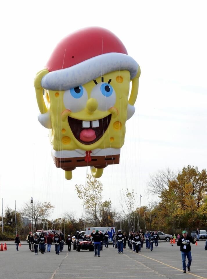 The SpongeBob SquarePants balloon takes a test flight during the Macy's Thanksgiving Day Parade Balloonfest at New Jersey's MetLife Stadium. Bad weather means the balloons may be grounded this year.