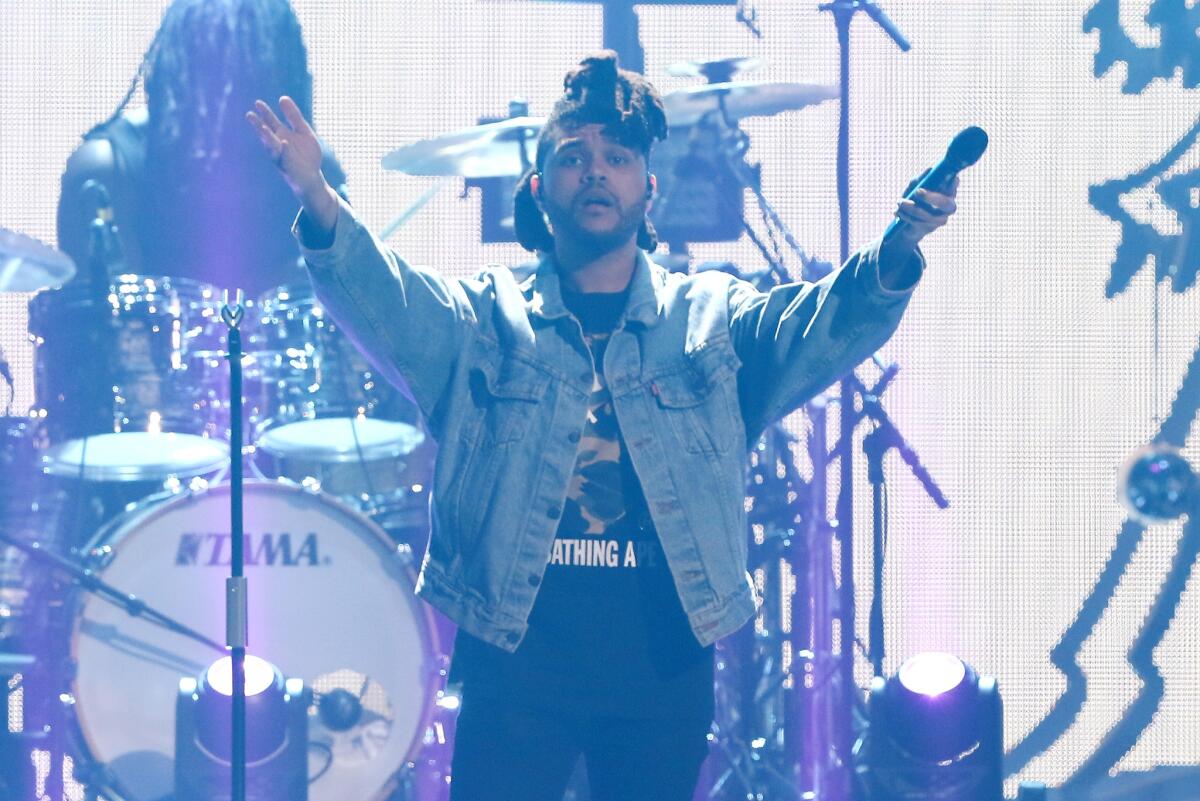 The Weeknd performs onstage at Y100's Jingle Ball 2015 presented by Capital One at BB&T Center on December 18, 2015 in Sunrise, Florida.