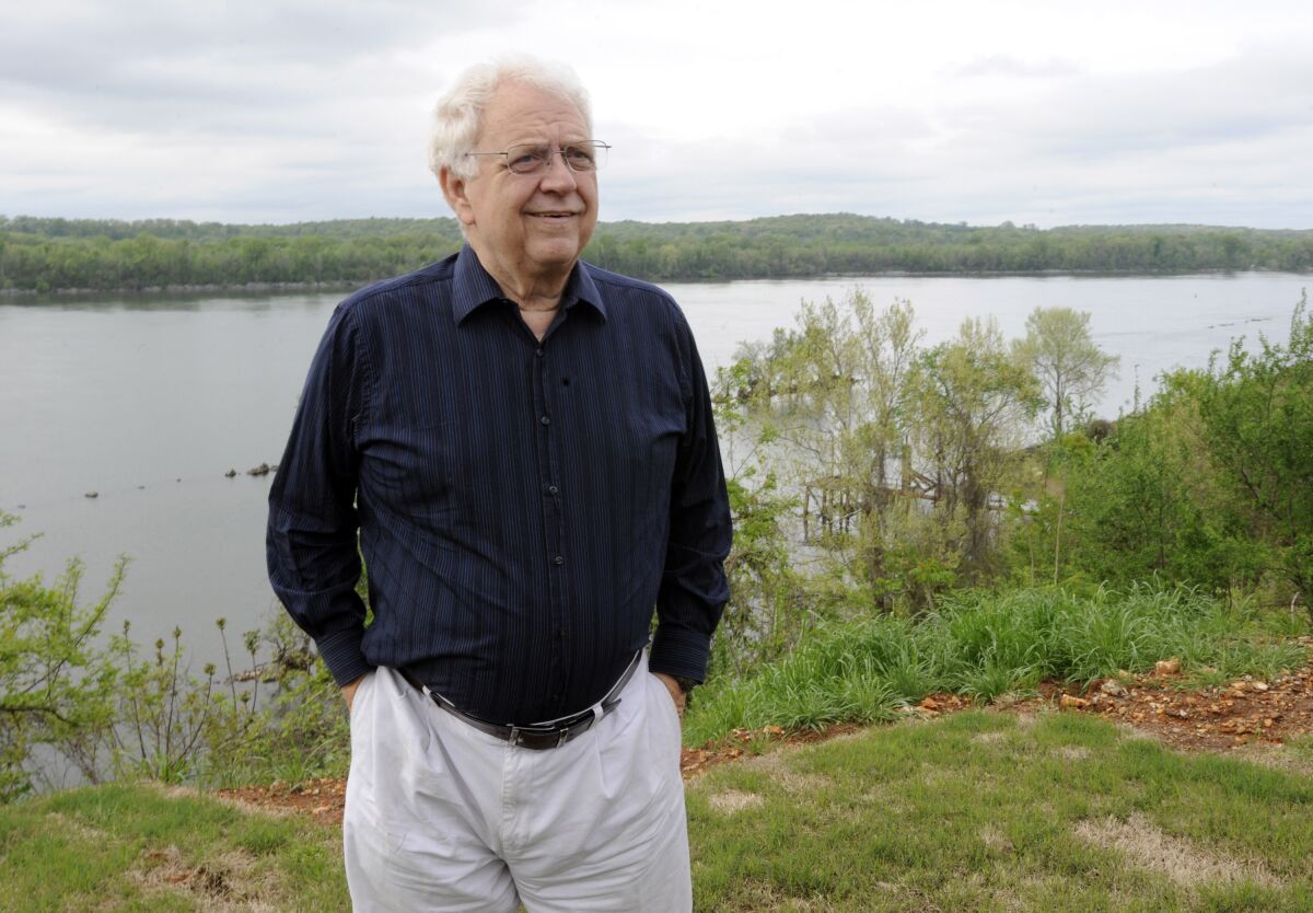 Jimmy Johnson outside his home on the Tennessee River in Sheffield, Ala., in 2015.