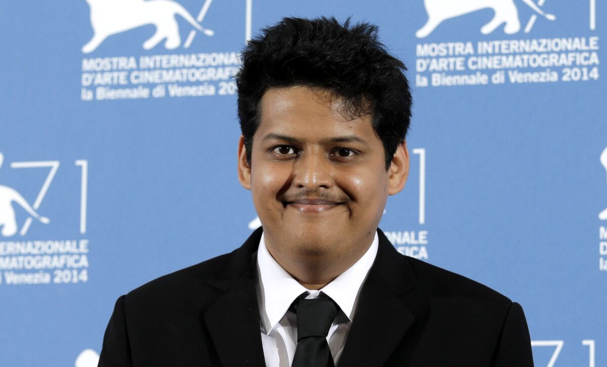 FILE - Chaitanya Tamhane poses during a photo call for "Court" at the 71th edition of the Venice Film Festival on Sept. 6, 2014, in Venice, Italy. Writer-director Tamhane's "The Disciple," a film about a classical musician's struggle to balance his career dreams and life in contemporary Mumbai, will return India to the main competition at the upcoming Venice Film Festival for the first time in nearly two decades. (AP Photo/Andrew Medichini, File)