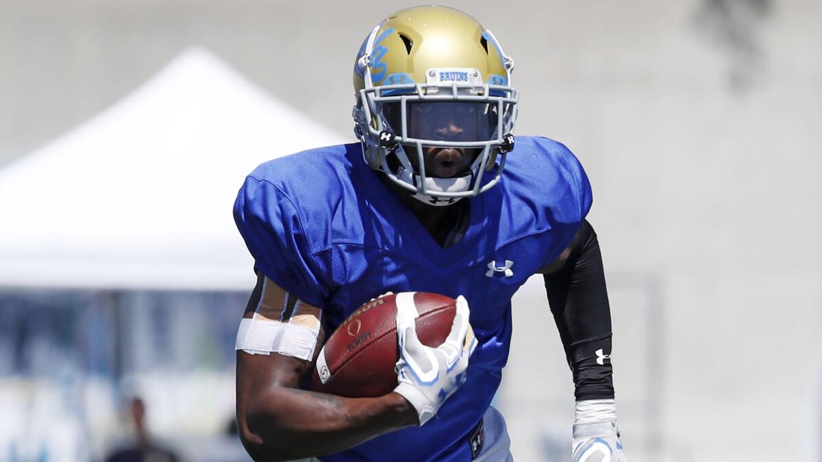 UCLA defensive back Mo Osling returns an interception during the Bruins' spring football game on April 21, 2018.