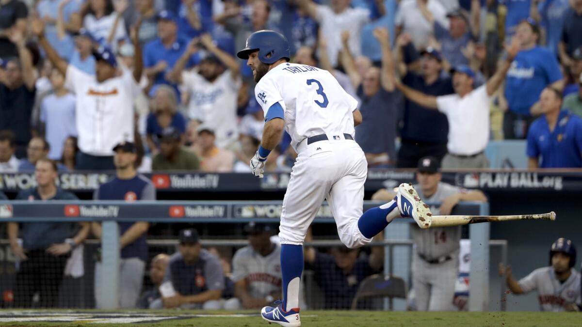 Dodgers center fielder Chris Taylor watches his leadoff home run against the Houston Astros during the first inning of Game 1.