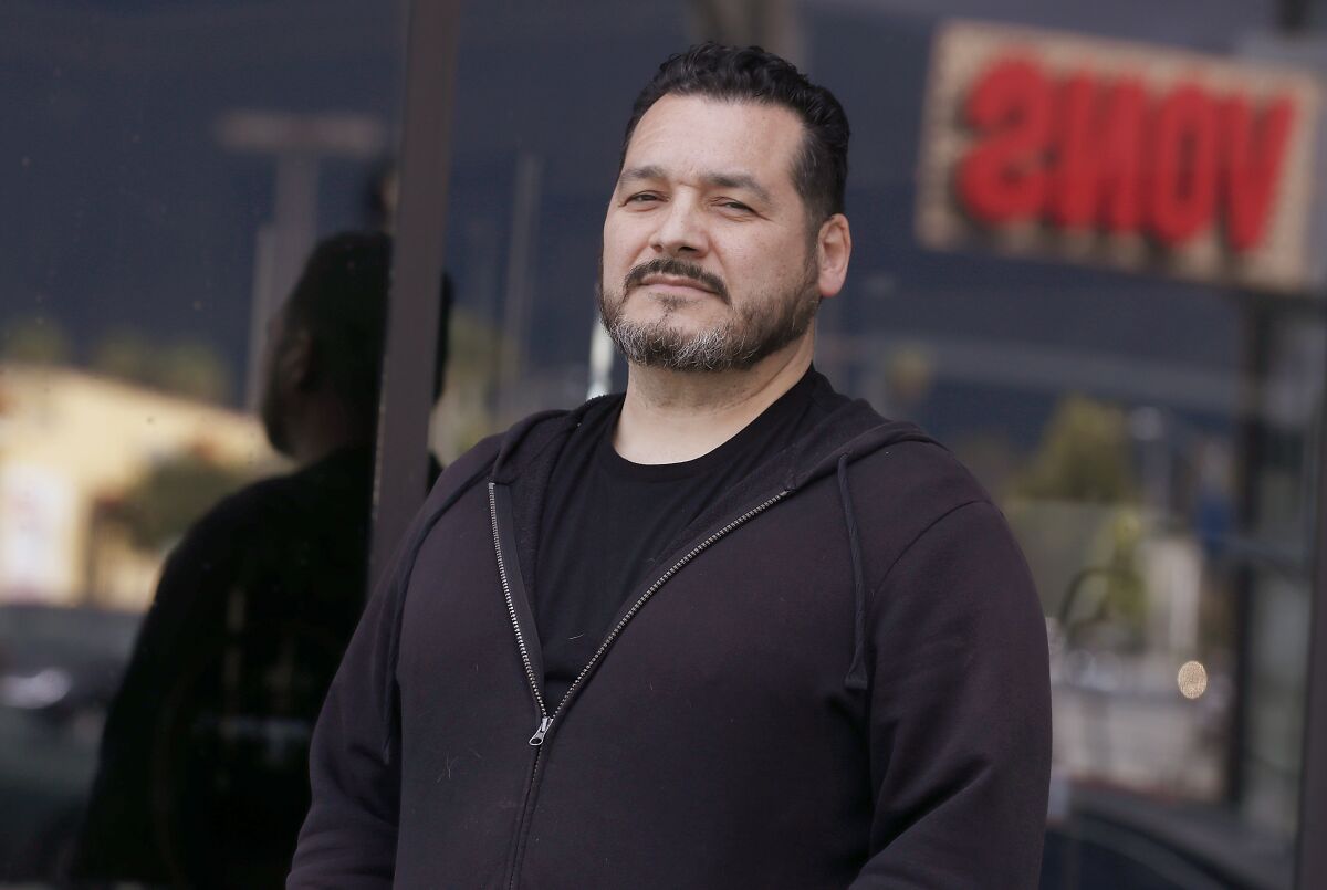 Grocery store employee Raymond Lopez