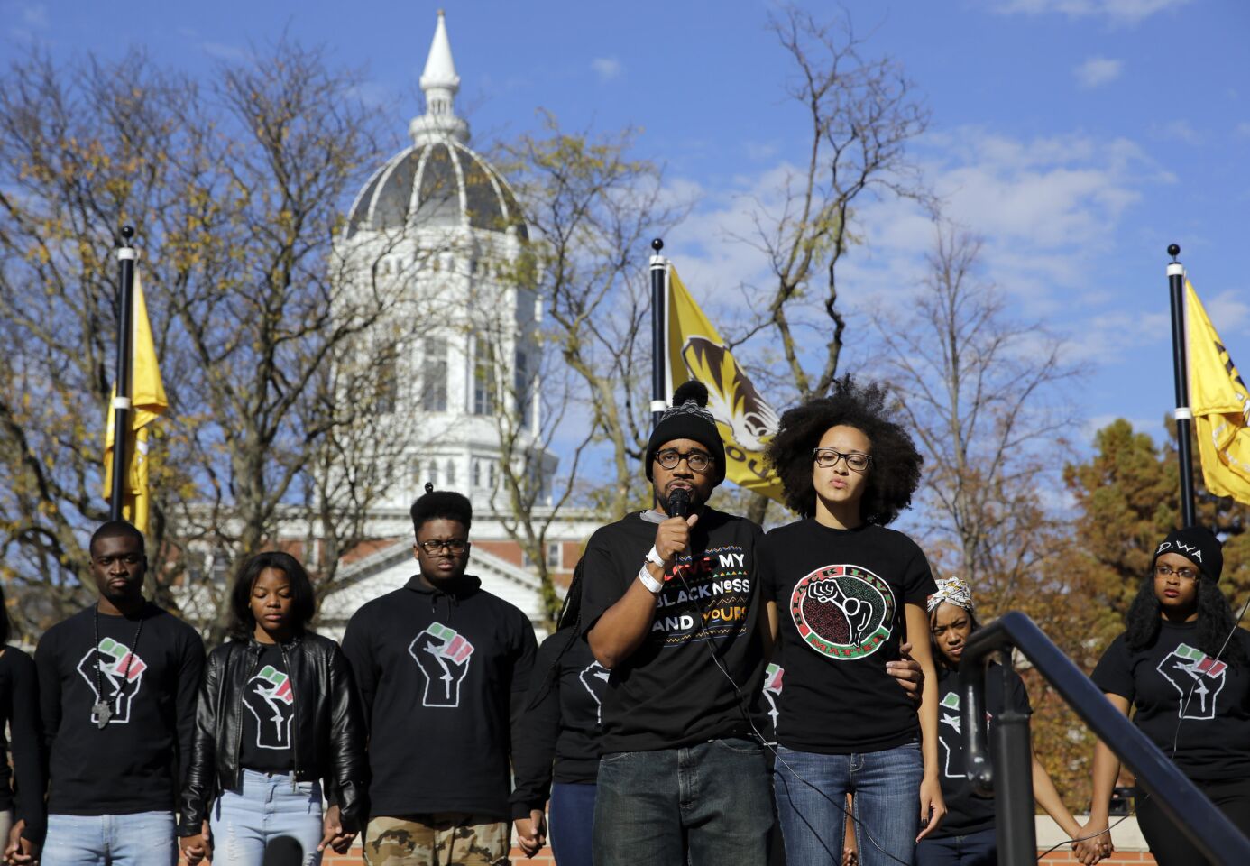 Jonathan Butler, a graduate student who was on a hunger strike calling for the university president's removal, addresses a crowd following the announcement that University of Missouri System President Tim Wolfe would resign. Butler has ended his hunger strike.