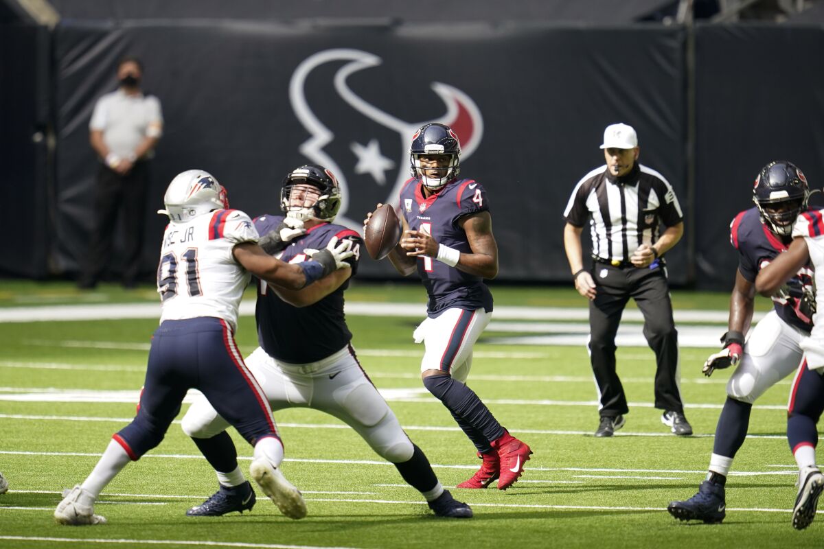 Houston Texans quarterback Deshaun Watson looks to pass against the New England Patriots.