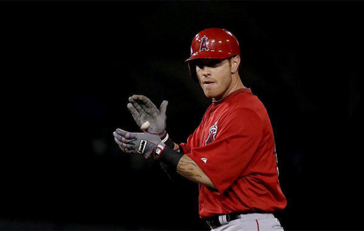 Angels outfielder Josh Hamilton celebrates after hitting a double against the Dodgers in an exhibition game.