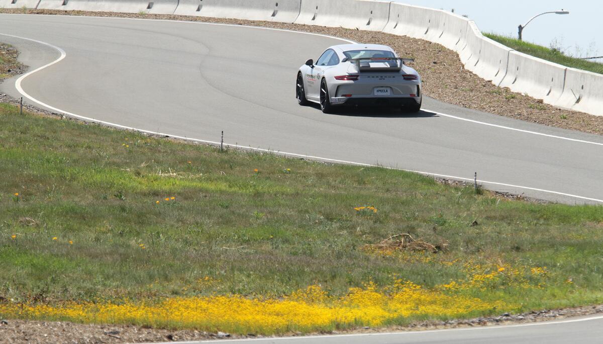 A Porsche GT3 maneuvers through the Handling Circuit at the Porsche Experience Center.