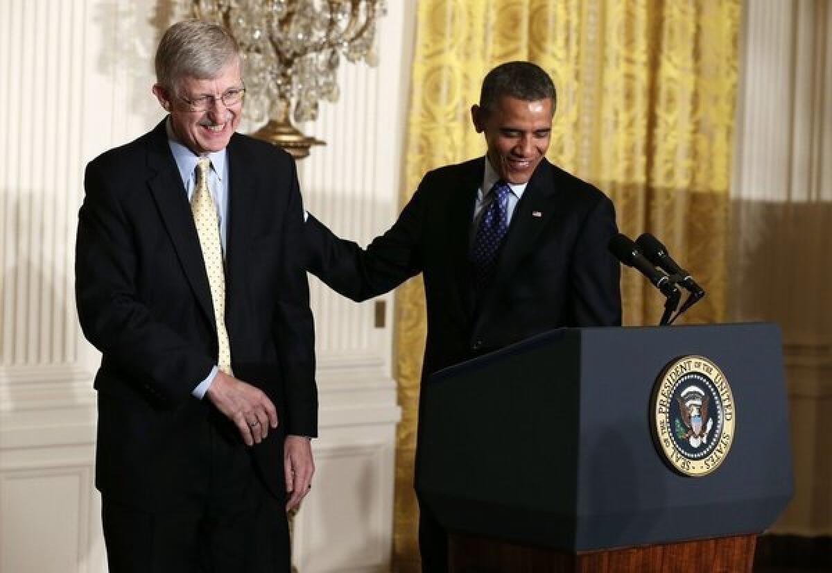 Dr. Francis Collins, director of the National Institutes of Health, helps President Obama introduce the administration's BRAIN Initiative at the White House.