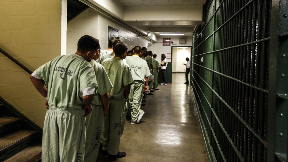 A line forms inside the general area at the Men's Central Jail in Los Angeles.