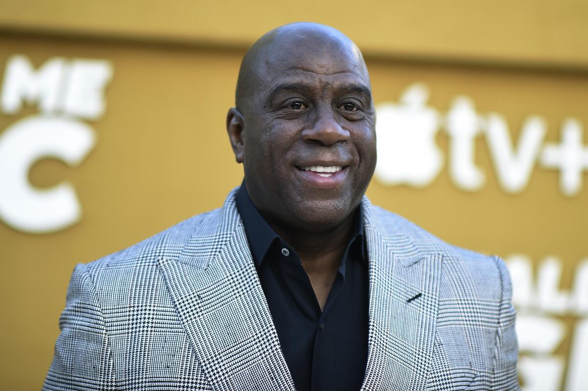 Magic Johnson arrives at the premiere of "They Call Me Magic".