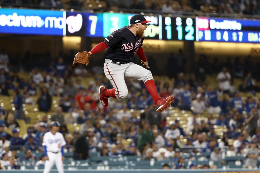 LOS ANGELES, CALIFORNIA - OCTOBER 09: Sean Doolittle #63 of the Washington Nationals celebrates the final out as the Nationals defeated the Los Angeles Dodgers 7-3 in game five to win the National League Division Series at Dodger Stadium on October 09, 2019 in Los Angeles, California. (Photo by Sean M. Haffey/Getty Images) ** OUTS - ELSENT, FPG, CM - OUTS * NM, PH, VA if sourced by CT, LA or MoD **