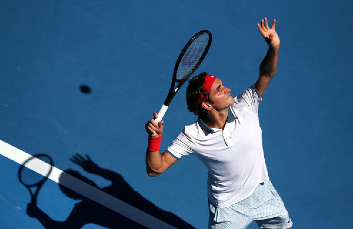 Roger Federer serves during his first-round victory over James Duckworth at the Australian Open on Tuesday.