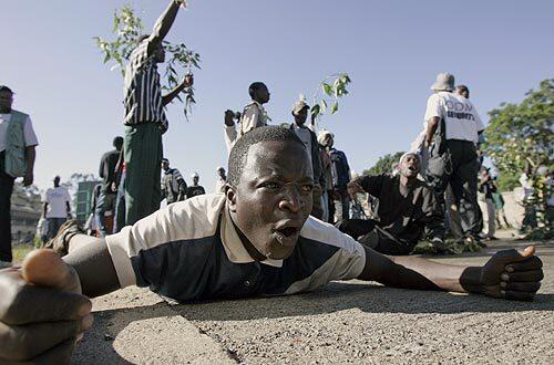 Supporters of opposition leader Raila Odinga gather in Nairobi, Kenya, to protest President Mwai Kibaki's victory in an election they say was rigged.