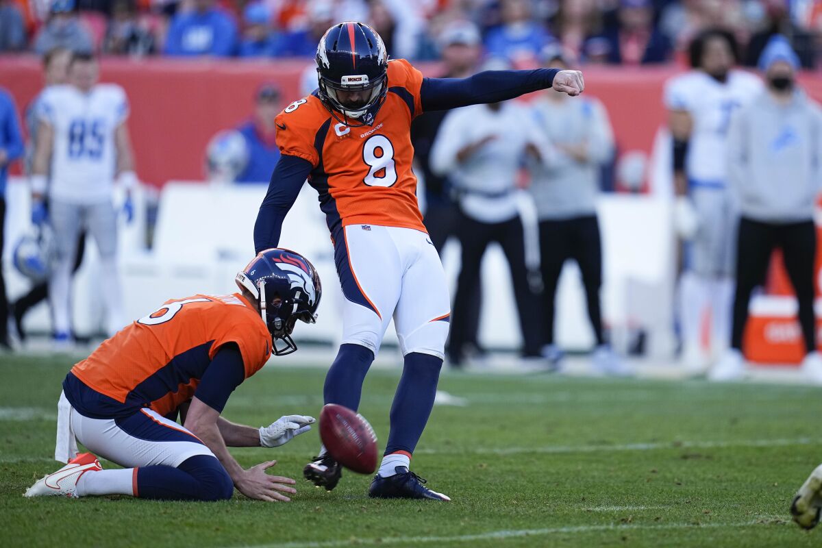 FILE - Denver Broncos kicker Brandon McManus (8) kicks a field goal against the Detroit Lions during an NFL football game on Dec. 12, 2021, in Denver. Not to seem ungrateful, but McManus isn't sure he deserves his AFC special teams player of the week award for kicking five extra points and a 52-yard field goal in the Denver Broncos' blowout of the Detroit Lions. “Obviously I appreciate the award and I was able to honor Demaryius wearing my cleats,” added McManus, who honored the memory of former teammate Demaryius Thomas, who death last week at age 33 rocked the NFL. (AP Photo/Jack Dempsey, File)