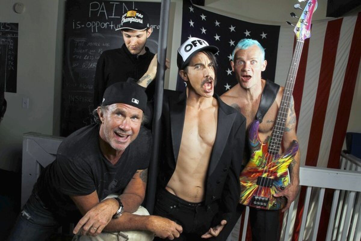 A FRESH OUTLOOK: The Chili Peppers -- Chad Smith, left, Josh Klinghoffer, Anthony Kiedis and Flea -- have a new album, "I'm With You," due out this month.