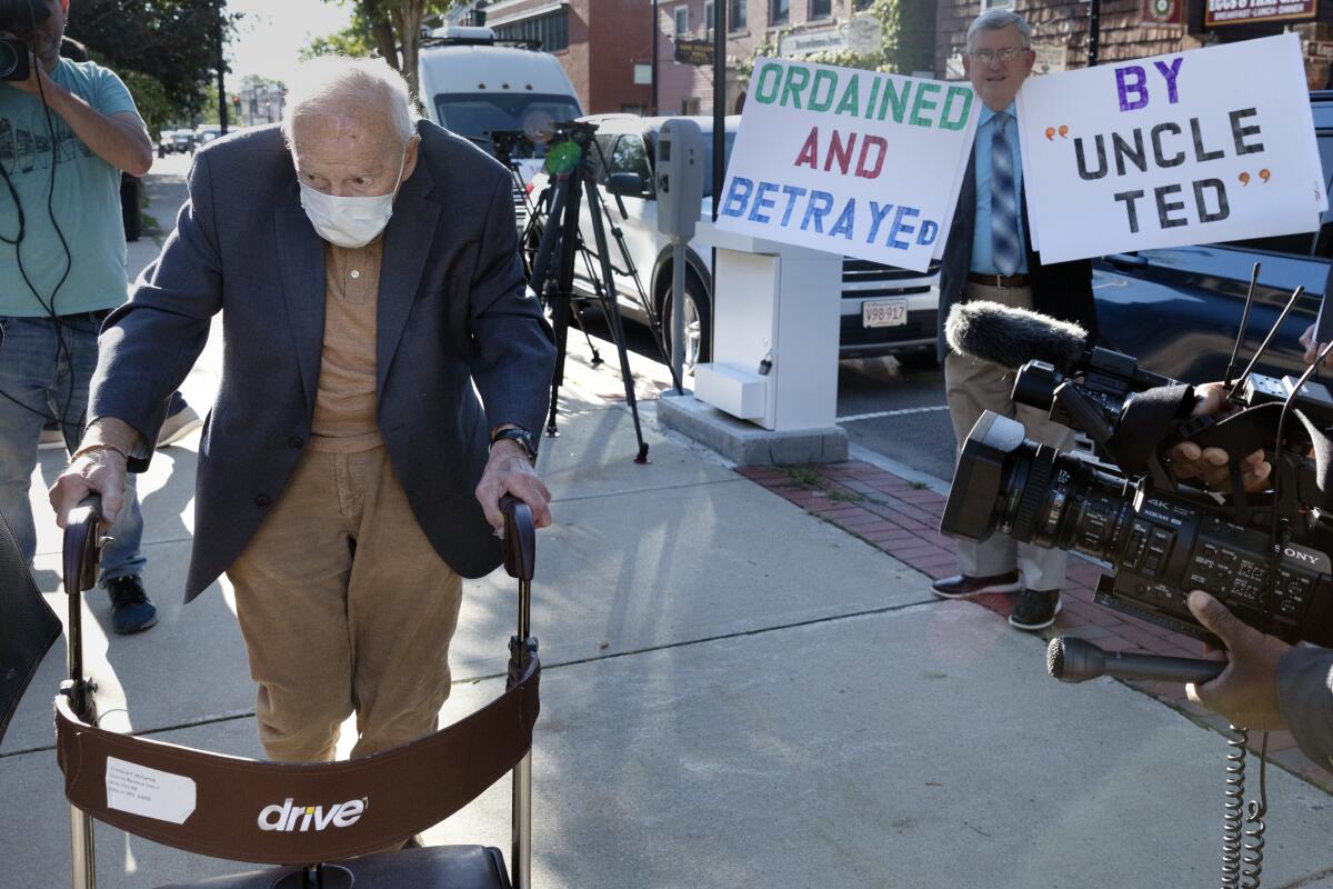 Former Roman Catholic Cardinal Theodore McCarrick using a walker