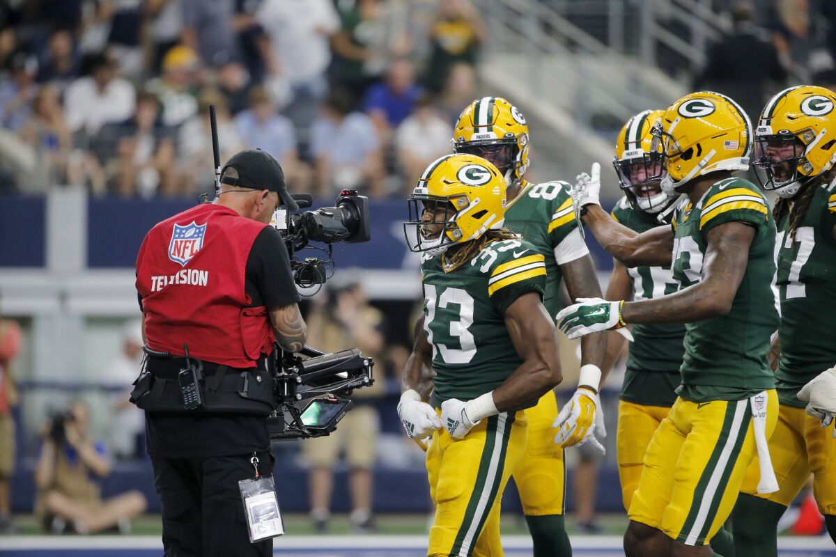 Green Bay Packers running back Aaron Jones celebrates with his teammates after scoring a touchdown against the Dallas Cowboys in October.