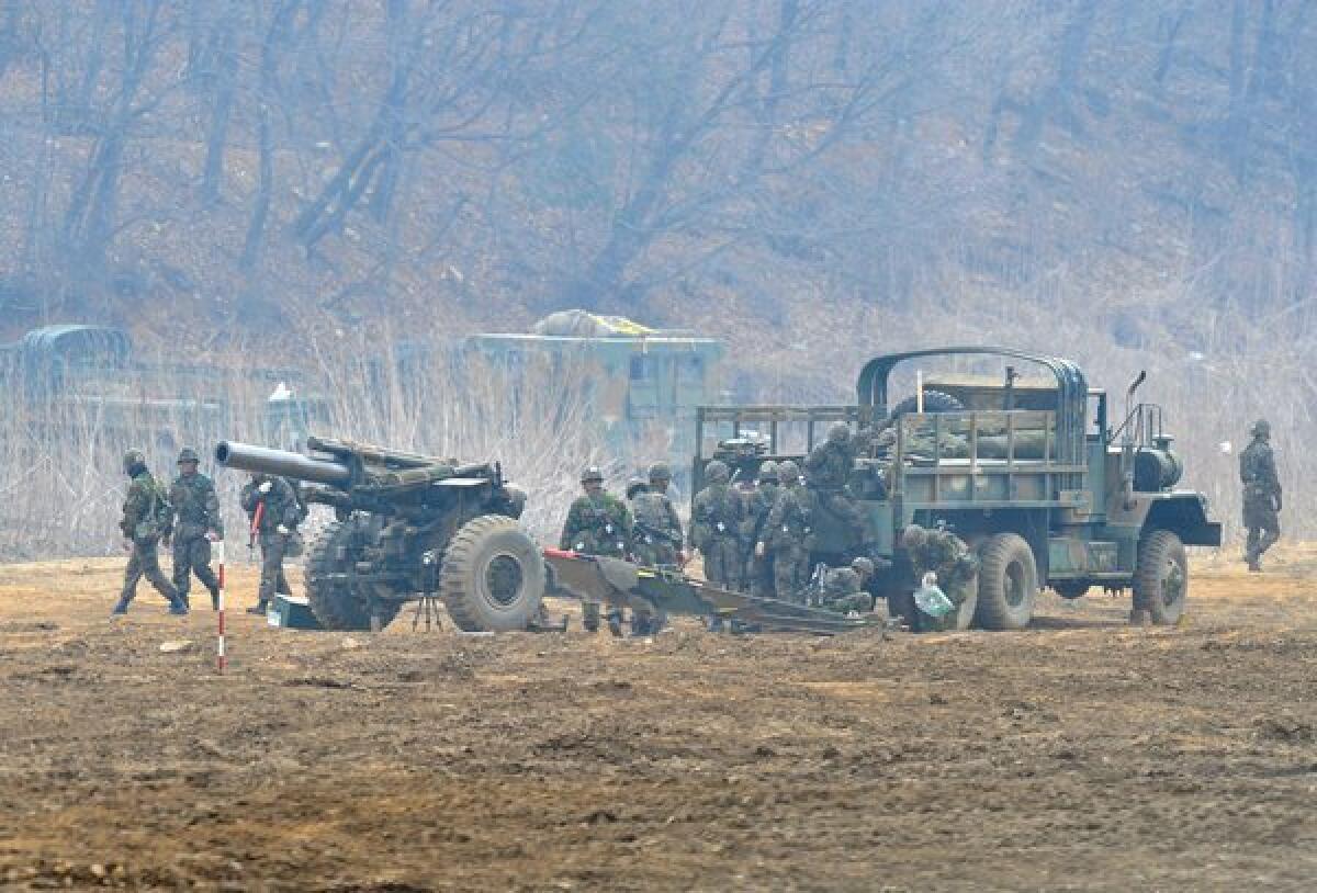 South Korean soldiers man a cannon at a military training field near the border city of Paju.