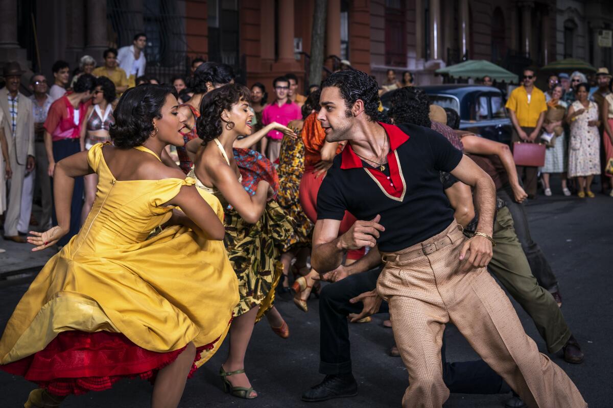 Several couples dancing in the street.