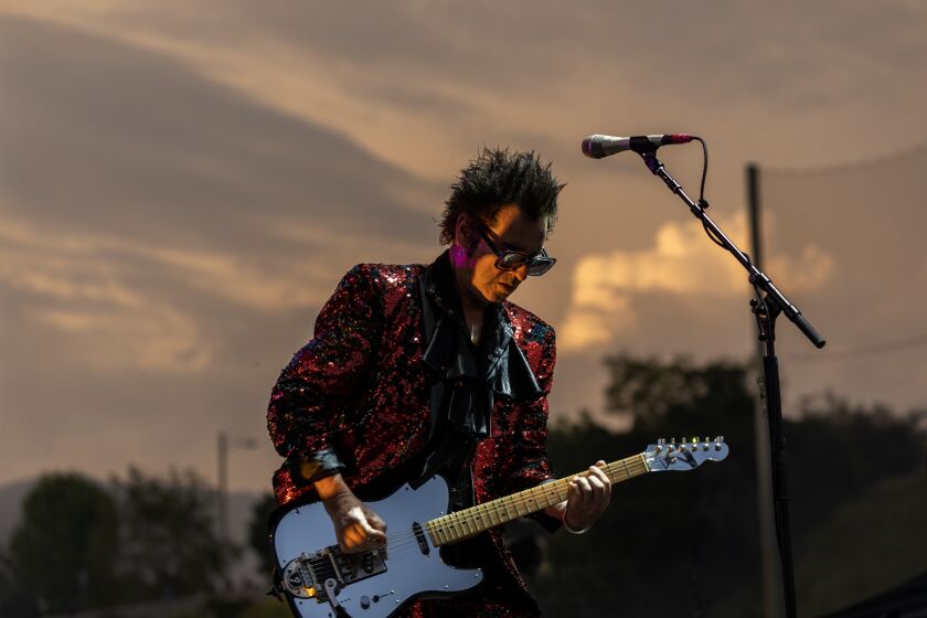 Pasadena, CA - May 20: Love And Rockets singer and guitarist Daniel Ash performs at dusk on the Outsiders stage at Cruel World Festival at Brookside at the Rose Bowl, on Saturday, May 20, 2023. (Allen J. Schaben / Los Angeles Times)