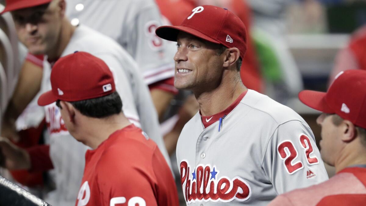 Philadelphia Phillies manager Gabe Kapler (22) watches during the first inning of a game against the Miami Marlins.