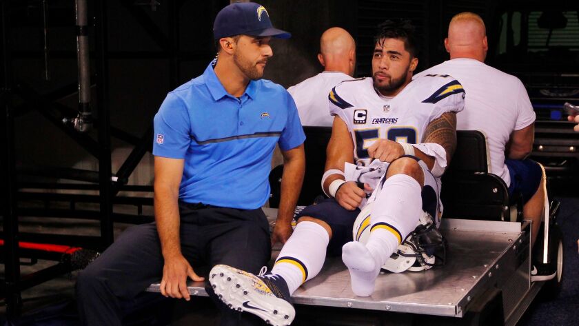 San Diego Chargers Manti Te'o injured his leg in the 1st quarter against the Colts at Lucas Oil Stadium on Sunday, Sept. 25, 2016. Photo by K.C. Alfred