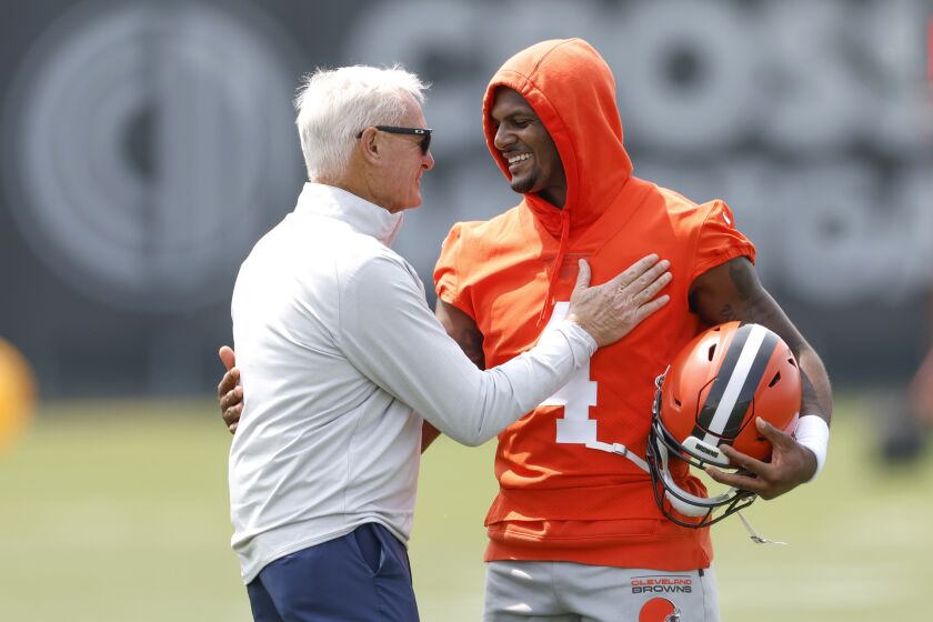 Cleveland Browns owner Jimmy Haslam talks with quarterback Deshaun Watson (4) at the NFL football team's practice facility Wednesday, June 7, 2023, in Berea, Ohio. (AP Photo/Ron Schwane)
