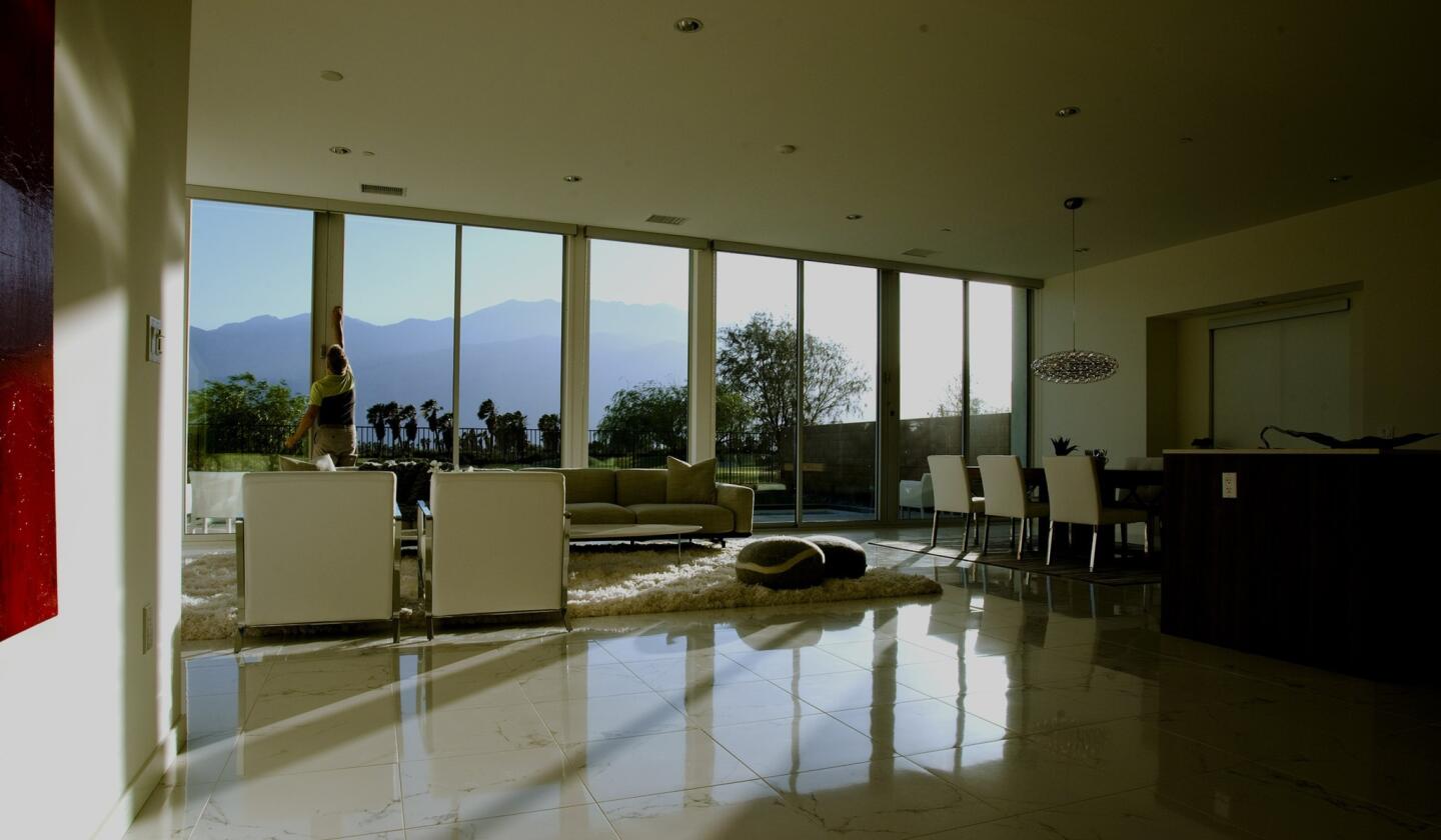 One of the Escena floor plans features an open kitchen that flows freely to a dining area and living room with 10-foot-tall floor-to-ceiling glass overlooking the San Jacinto Mountains.