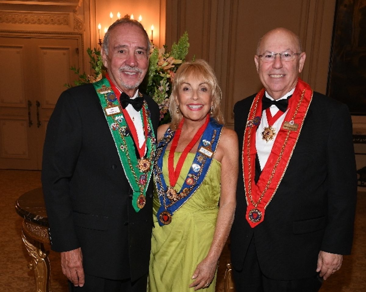 Marie Addario (center) and her husband Dominick (left) with Harold Small.
