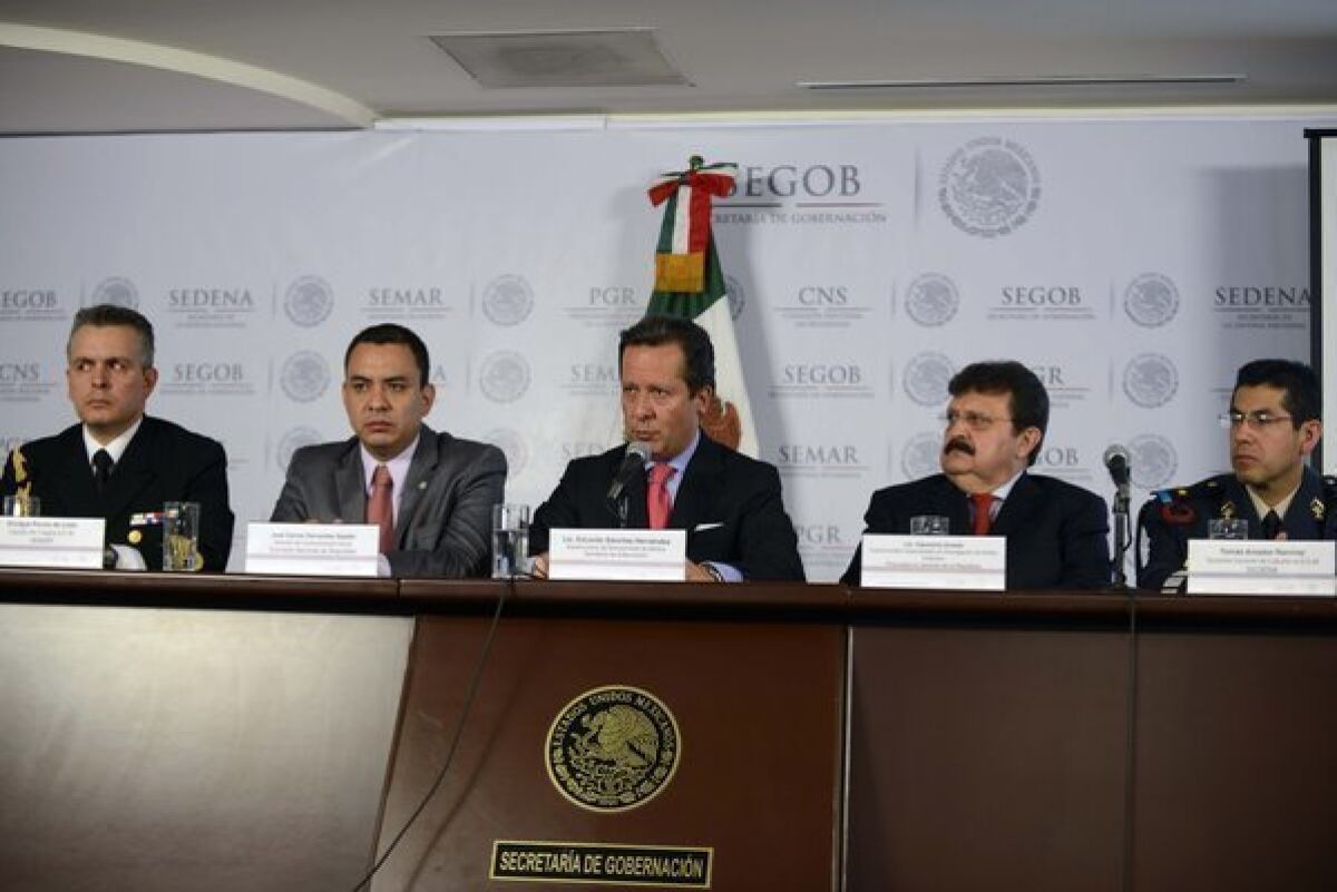 From left to right, Mexican Navy Capt. Enrique Ponce de Leon, National Commission of Security media director Carlos Cervantes, the under-secretary of media for the Interior Ministry, Eduardo Sanchez, the under-attorney for organized crime, Cleominio Soreda, and Mexican Army Lt. Col. Tomas Amador, attend a press conference Tuesday in Mexico City on the capture of Ines Coronel Barrera, father-in-law and associate of drug kingpin Joaquin "Chapo" Guzman.