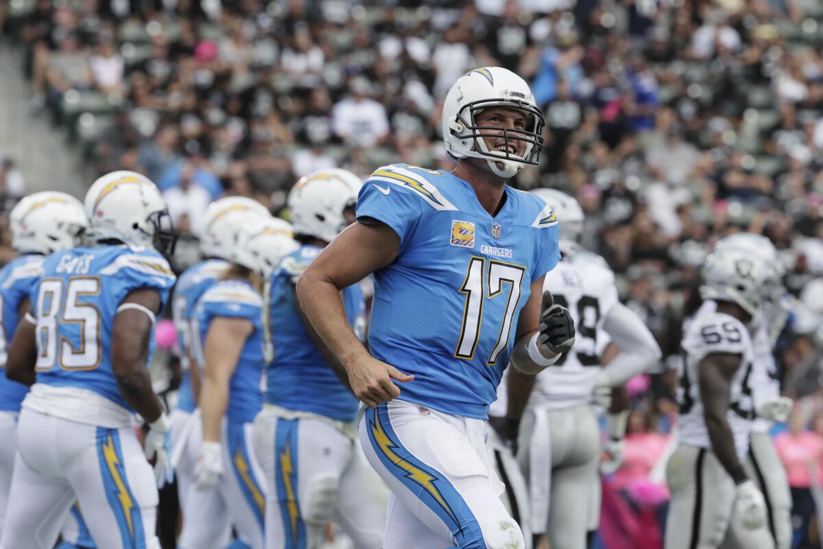 Chargers quarterback Philip Rivers smiles after leading the Chargers on a first-half scoring drive against the Oakland Raiders at StubHub Center on Oct. 7.