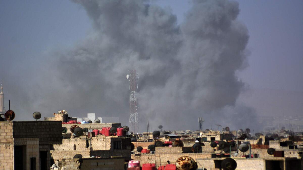 Smoke billows after April 20 Syrian regime strikes targeting Islamic State in the Palestinian camp of Yarmouk near Damascus.