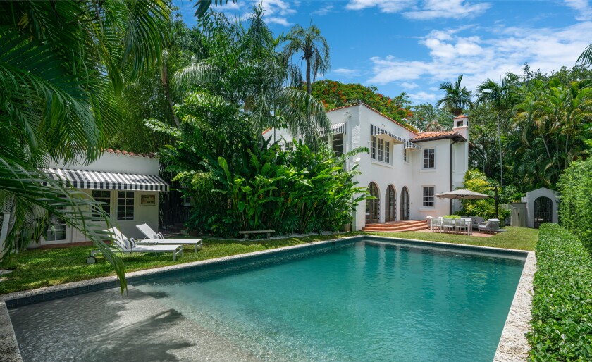 The quarter-acre compound includes a 1920s Spanish-style villa, guesthouse and swimming pool.
