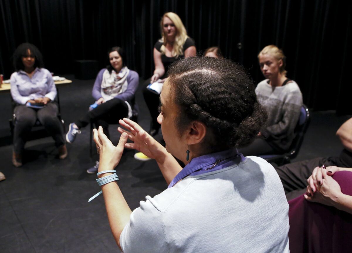 Director and CSUSM theater instructor Kaja Amado Dunn works with the cast of "Twilight: Los Angeles, 1992." — Don Boomer