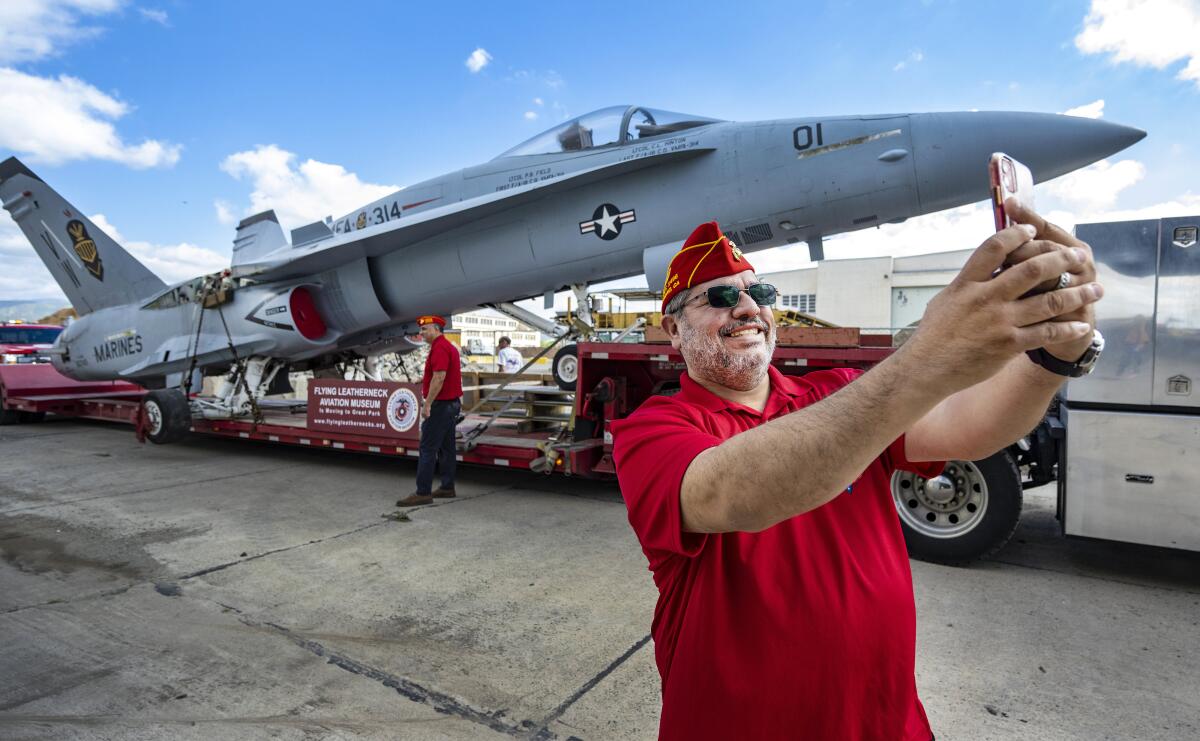 Gabriel Hurtado with the Marine Corps League takes a selfie with the Boeing F/A-18 Hornet. 