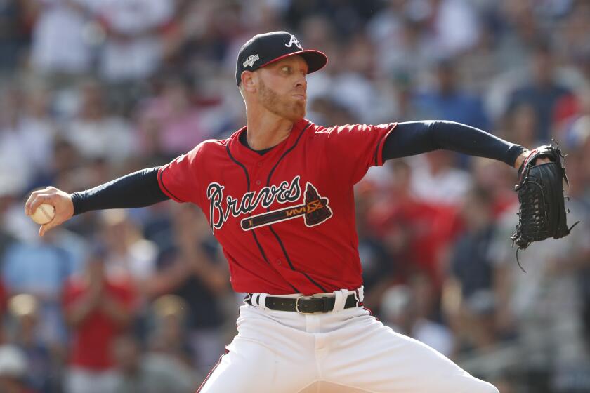 Atlanta Braves starting pitcher Mike Foltynewicz (26) works in the first inning during Game 2 of a best-of-five National League Division Series against the St. Louis Cardinals, Friday, Oct. 4, 2019, in Atlanta. (AP Photo/John Bazemore)