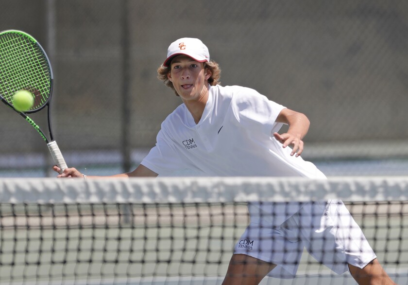 Niels Hoffmann of Corona del Mar steps into a volley for a point at the net with doubles partner Jack Cross on Thursday.