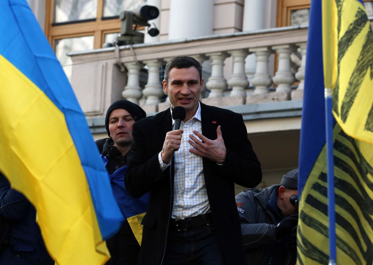 Vitali Klitschko addresses protesters in front of Ukraine's parliament Tuesday afternoon in downtown Kiev.