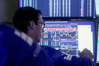 A trader works on the floor of the New York Stock Exchange in New York.