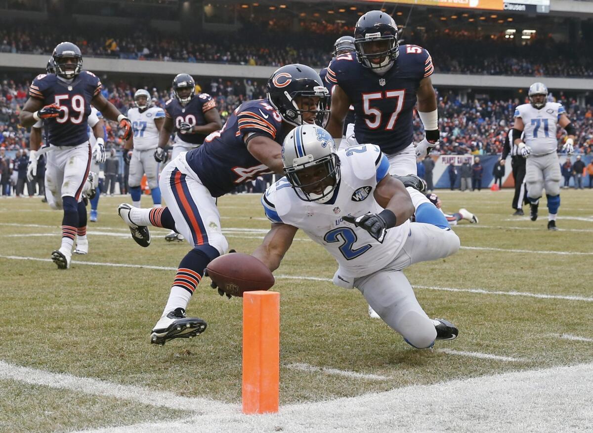 Detroit Lions running back Reggie Bush dives toward the goal line for a touchdown Sunday against the Chicago Bears.
