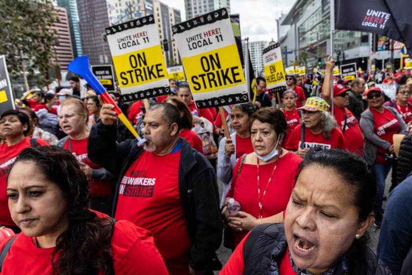LOS ANGELES, CA - OCTOBER 25: Hotel workers represented by Unite Here Local 11 hold a march for fair contract in the area where hotels are located in down town on Wednesday, Oct. 25, 2023 in Los Angeles, CA. (Irfan Khan / Los Angeles Times)