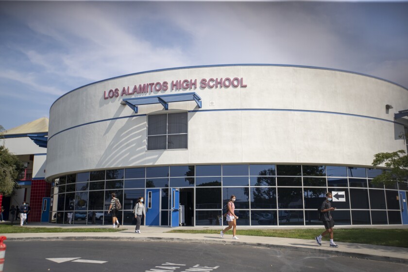 A building with the words "Los Alamitos High School" on it.