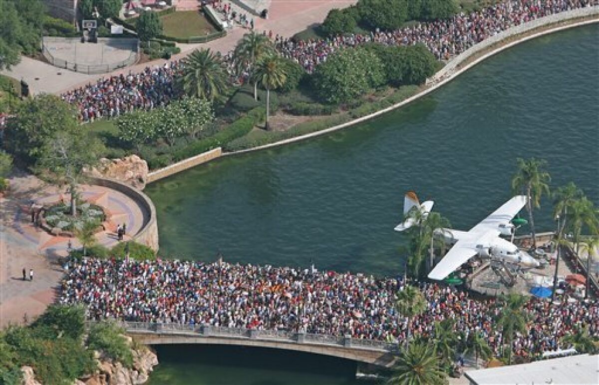 Thousands of people line up Friday, June 18, 2010 for the grand opening of the Wizarding World of Harry Potter at Universal's Islands of Adventure in Orlando, Fla. (AP Photo/ Orlando Sentinel, Red Huber)