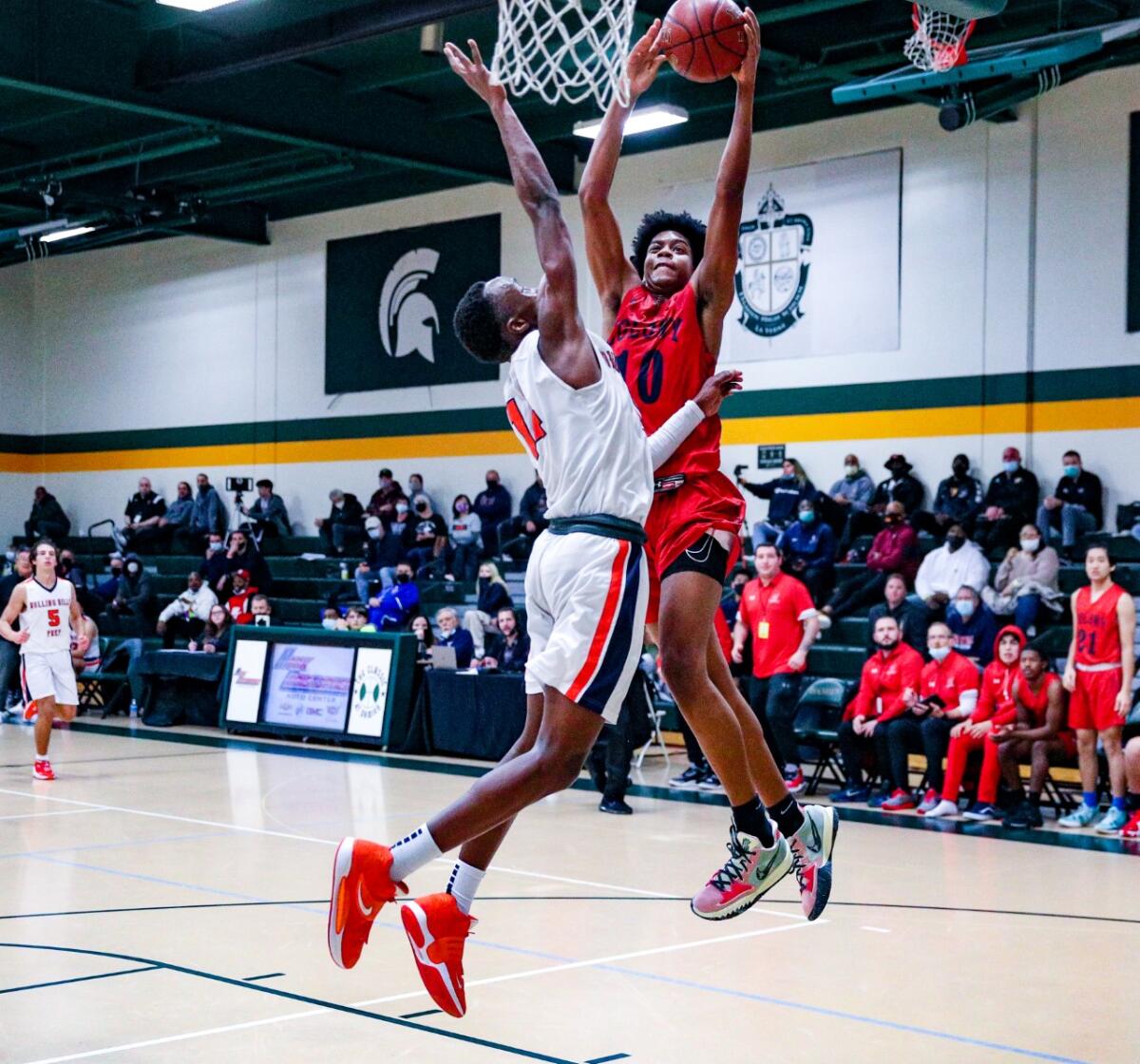 Colony High's Jaden Henley goes up for shot against Rolling Hills Prep's Kenny Manzi.