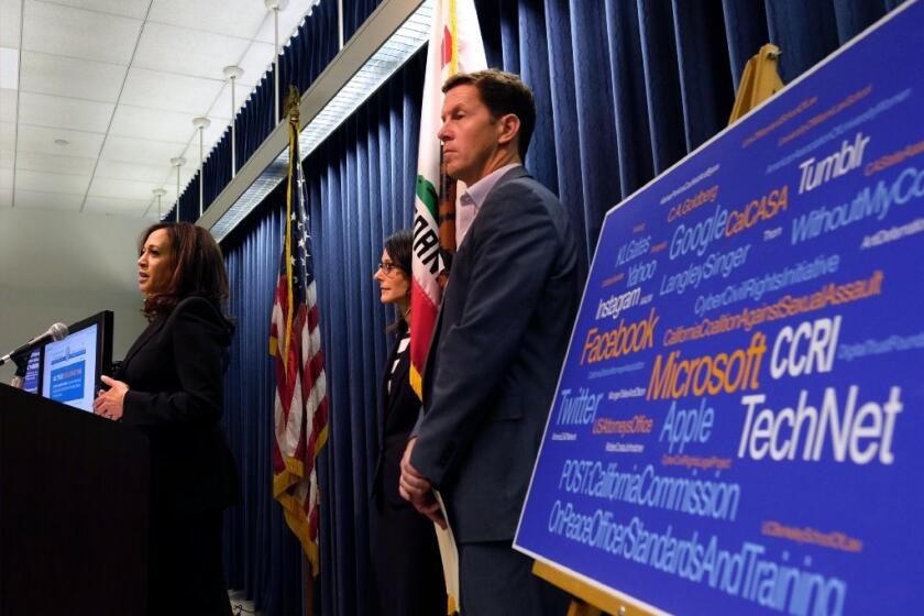 California's Attorney General Kamala Harris, left, announces that the state has teamed with leaders in the tech industry and law enforcement to combat cyberexploitation, the illegal practice of anonymously posting explicit photographs of others online, often to extort money from the victims.