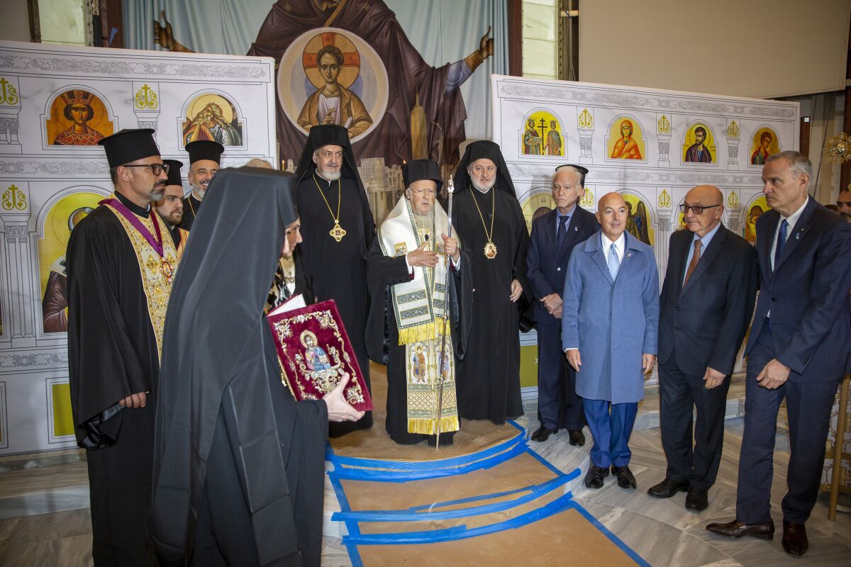 Ecumenical Patriarch Bartholomew of Constantinople leads the official door-opening ceremony of lower Manhattan's St. Nicholas Greek Orthodox Church on Tuesday, Nov. 2, 2021. The old St. Nicholas church was the only house of worship destroyed during the 9/11 attacks when it was crushed beneath the falling south tower. (AP Photo/Ted Shaffrey)